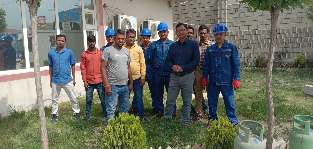 Cost Killer site team with hard hats at Master Steel